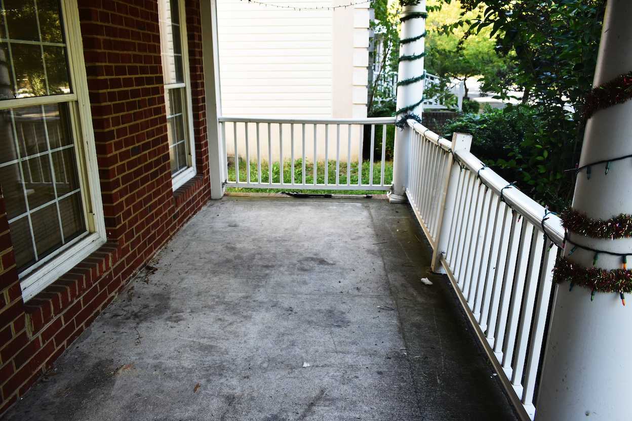 A dirty, disgusting patio before Pressure King treatment